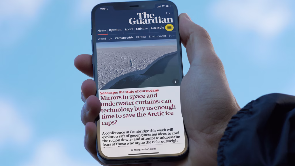 A phone viewing The Guardian Website